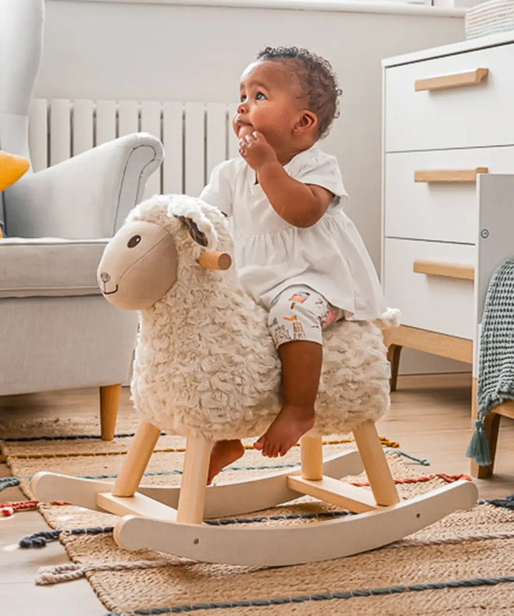 Cream plush rocking sheep toy with wooden rocker base and plaid ears