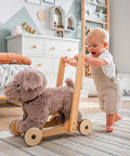 Stuffed dog baby walker with light wood frame, round wheels, gray plush body