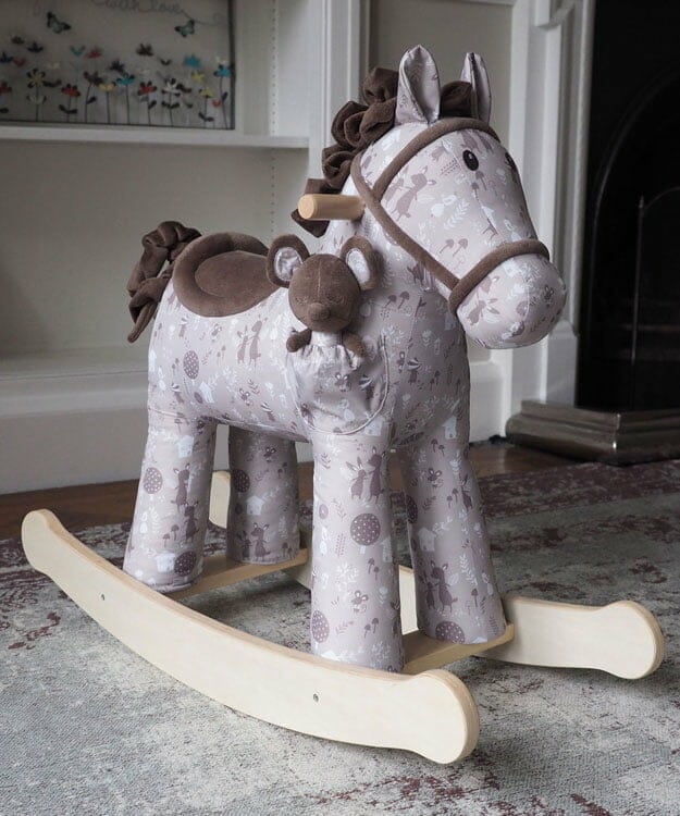 Plush rocking horse toy with wooden rockers and printed fabric body