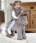 Grey plush rocking donkey with fabric ears and tail on a wooden rocker base