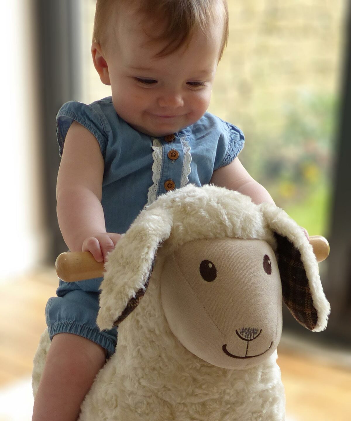 Baby Girl rocking on Lambert Rocking Sheep