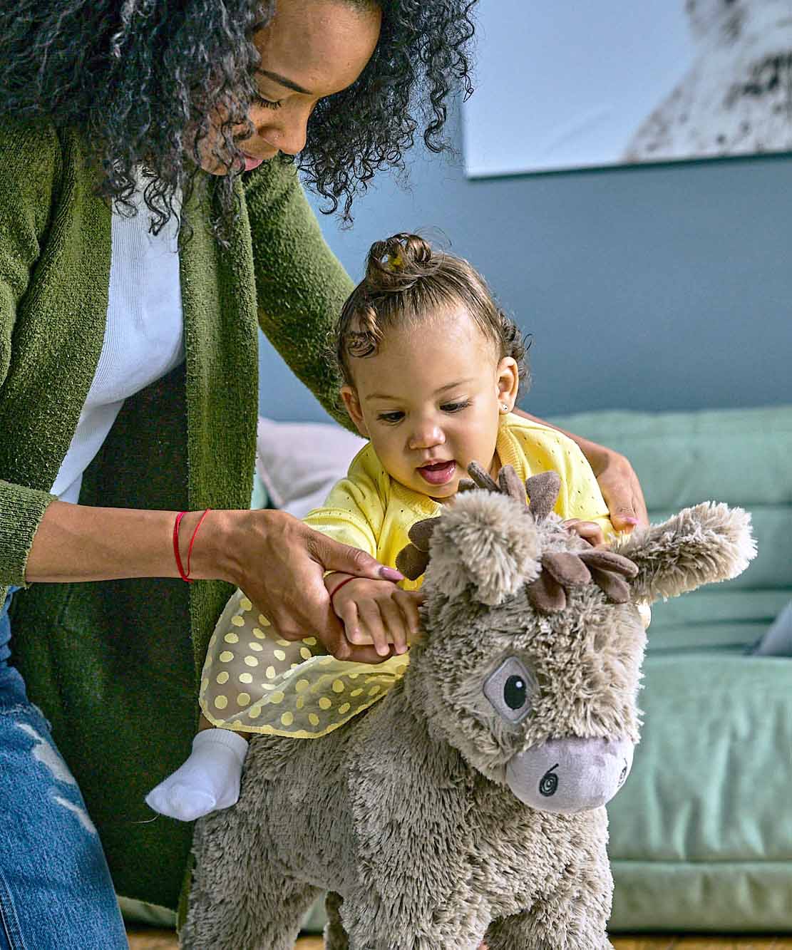 Mother and Toddler playing with Norbert Rocking Donkey with soft brown plush fabric