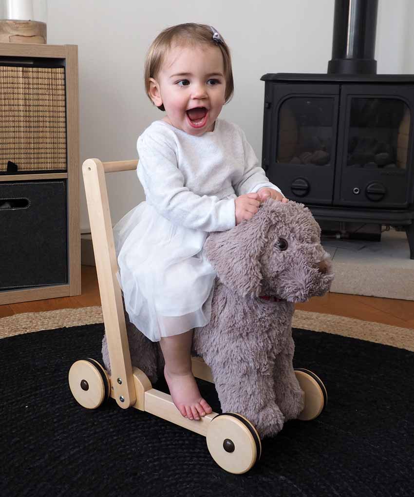 Toddler rides on Bailey Dog Baby Walker