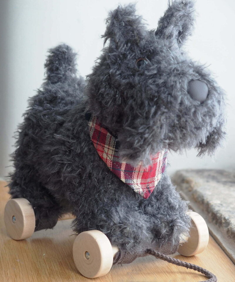 Close up of Scottie Dog Pull Along Toy on removable wheels 