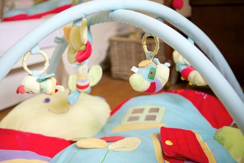 Close up showing thick plush base on the Softly Snail Multi-Activity Playgym