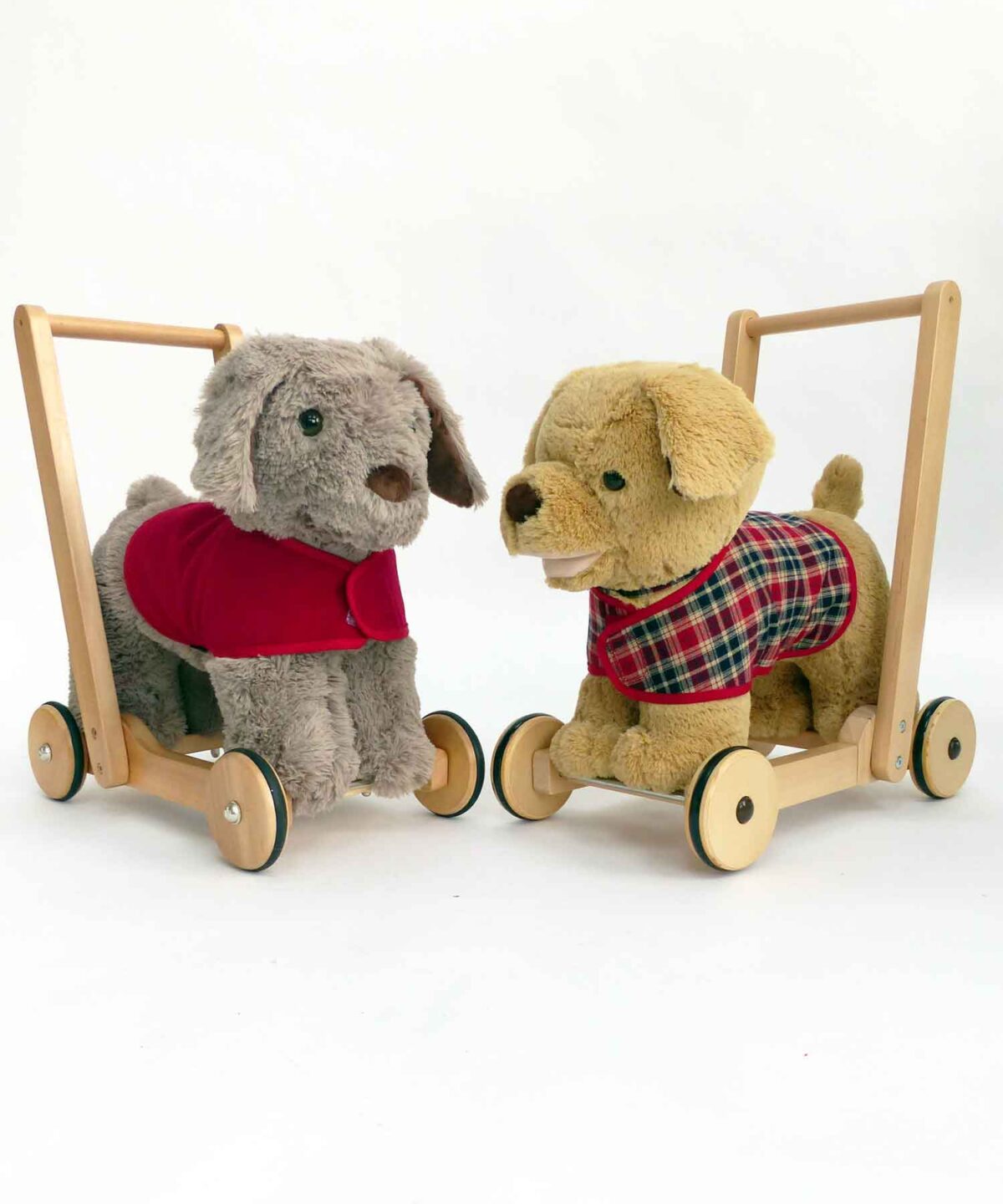 Two Push Along Dog Toys wearing bespoke fitted dog coat