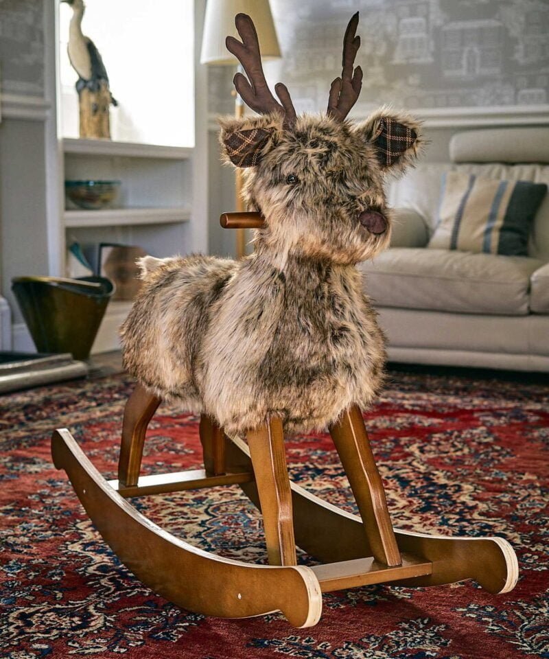 Hamilton rocking stag stands regally in front of cream sofa