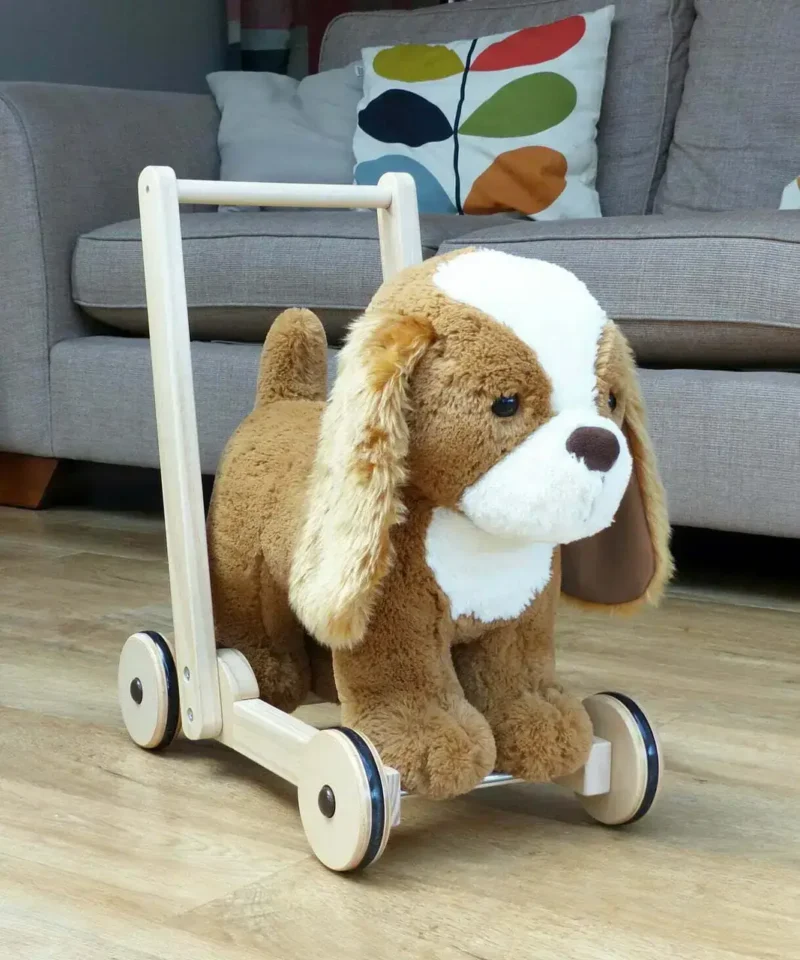 Peanut Pup Baby Walker on wooden floor in front of sofa 