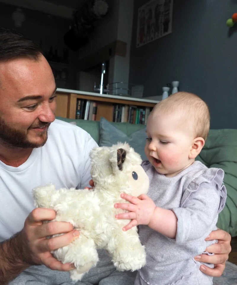 Dad and child with lambert pull along toy 