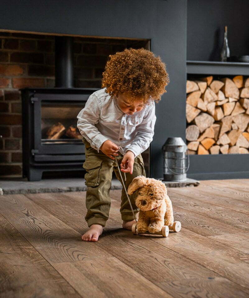 Little boy pulling dexter walking dog toy