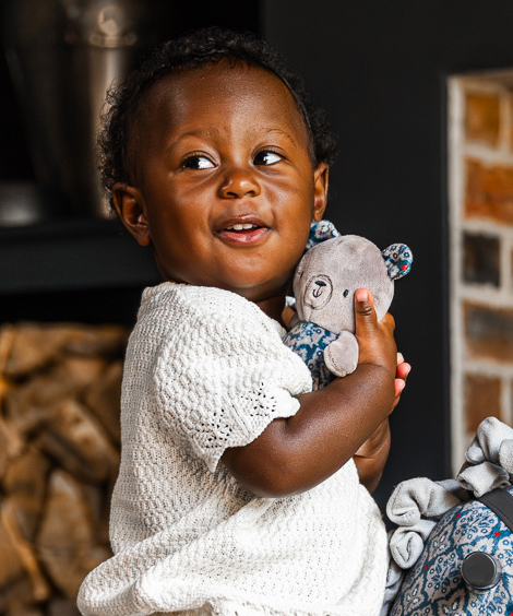 Blue bear toy with child